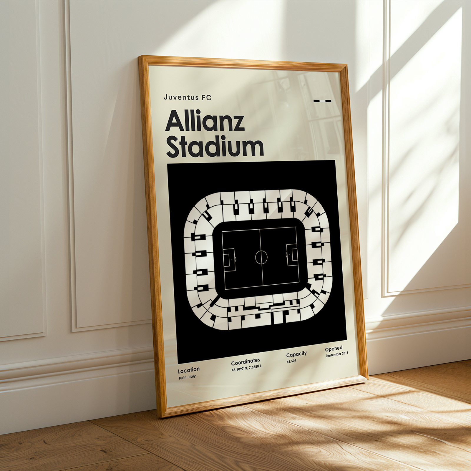 Framed poster of Juventus FC Allianz Stadium layout on a wall.