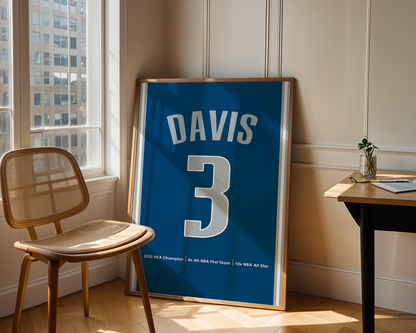 Framed sports jersey with 'Davis' and number '3' in a room with a window and chair.