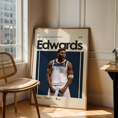Framed poster of a basketball player named Edwards in a room with a chair and table.