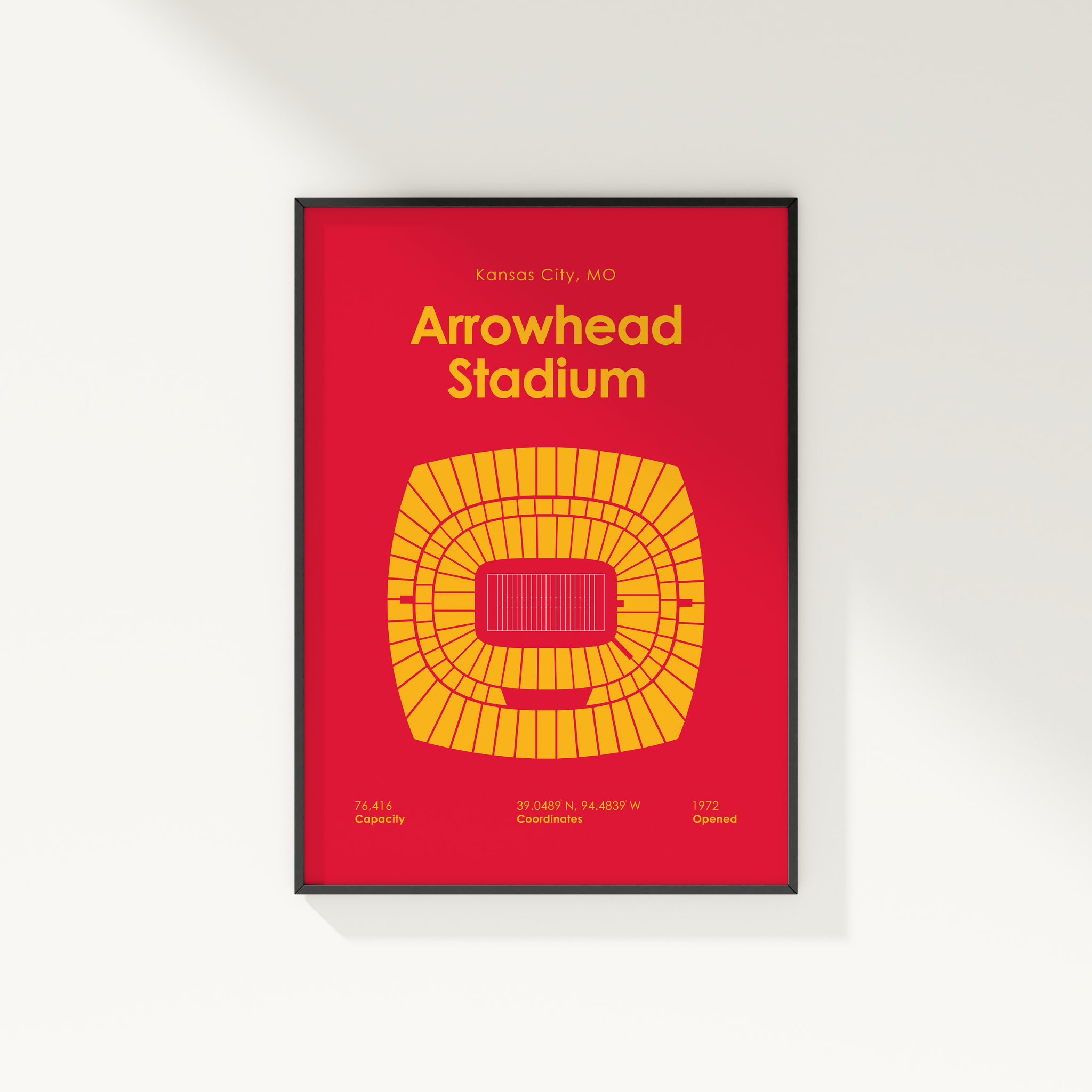 Framed poster of Arrowhead Stadium with red background and yellow seating chart.