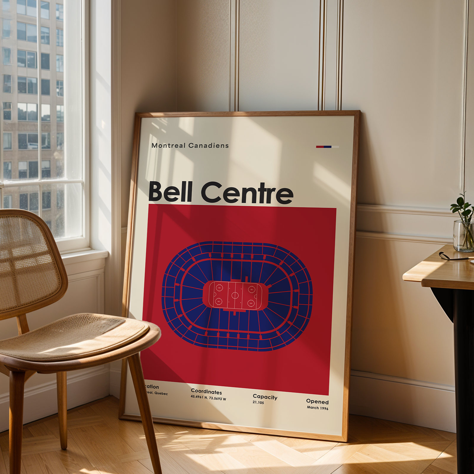 Poster of Bell Centre in a room with a chair and table