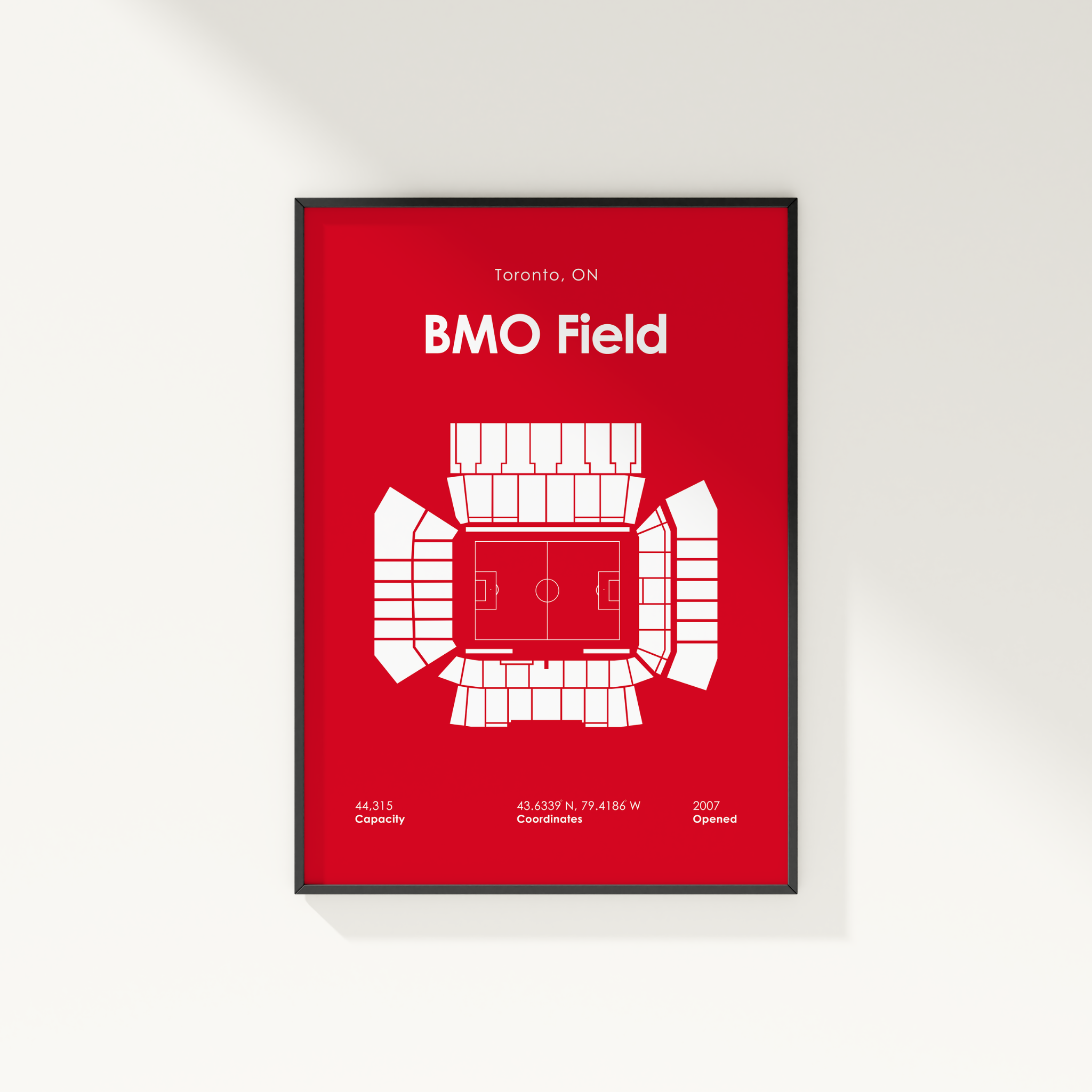 Framed poster of BMO Field with red background and white text