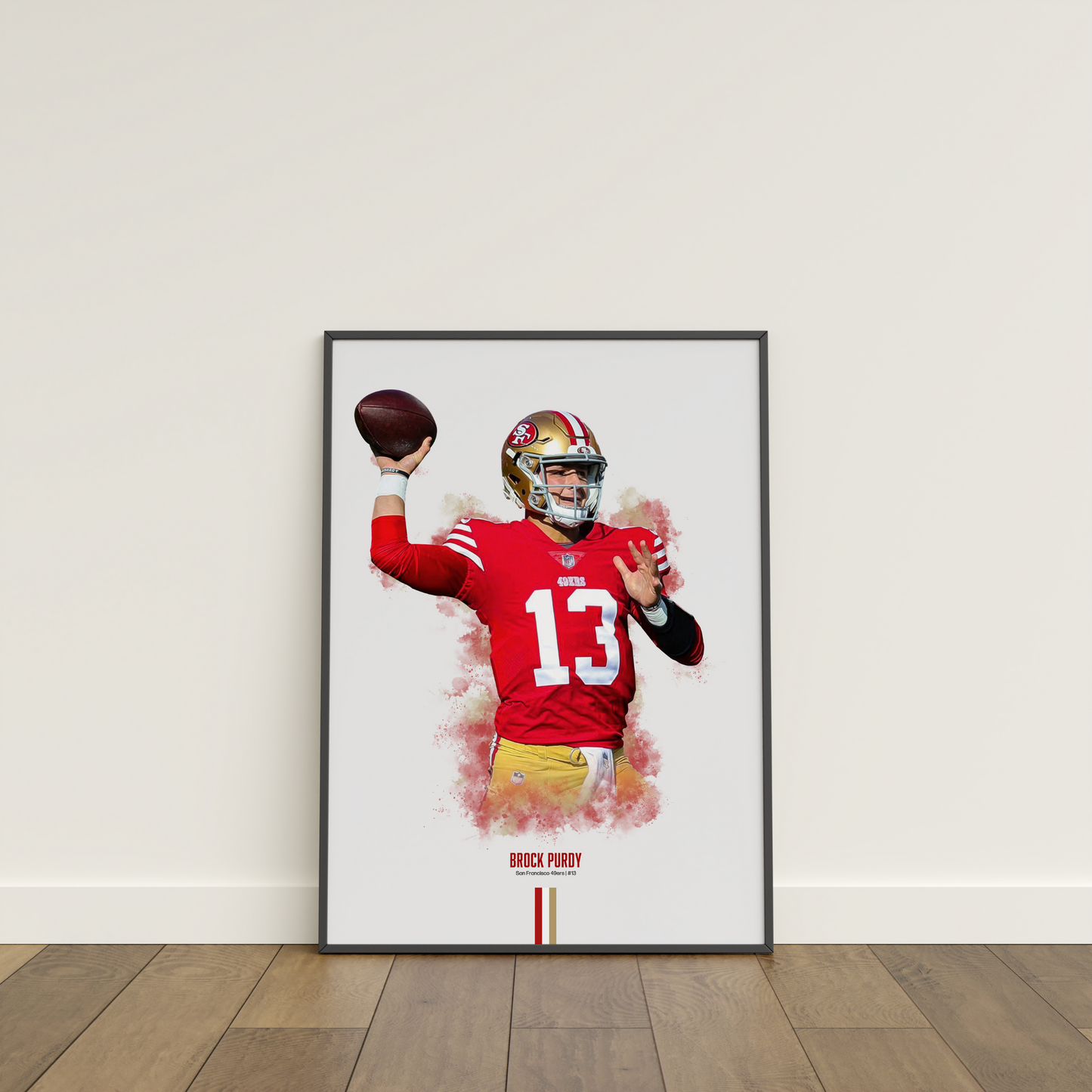 framed poster mockup of football player brock purdy leaning on a white wall