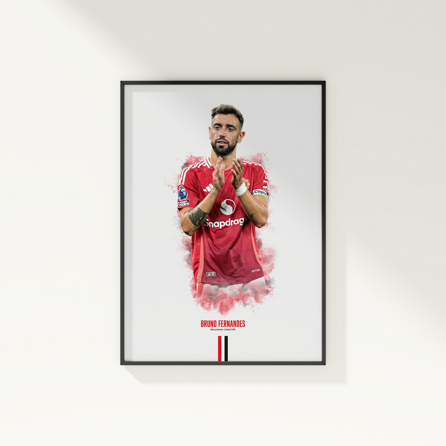 framed poster mockup of soccer player bruno fernandes hanging on a white wall