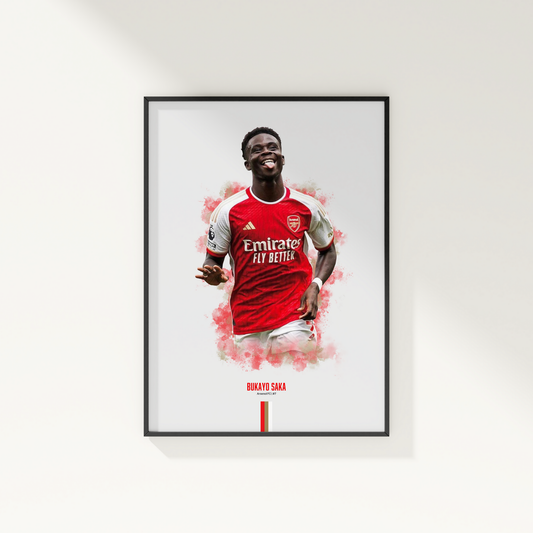 framed poster mockup of soccer player bukayo saka hanging on a white wall