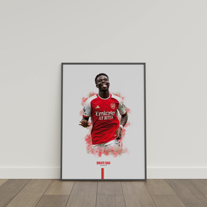 framed poster mockup of soccer player bukayo saka leaning on a white wall