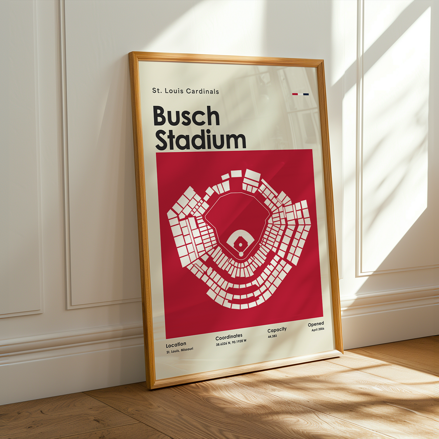 Framed poster of Busch Stadium layout with St. Louis Cardinals branding on a wall.