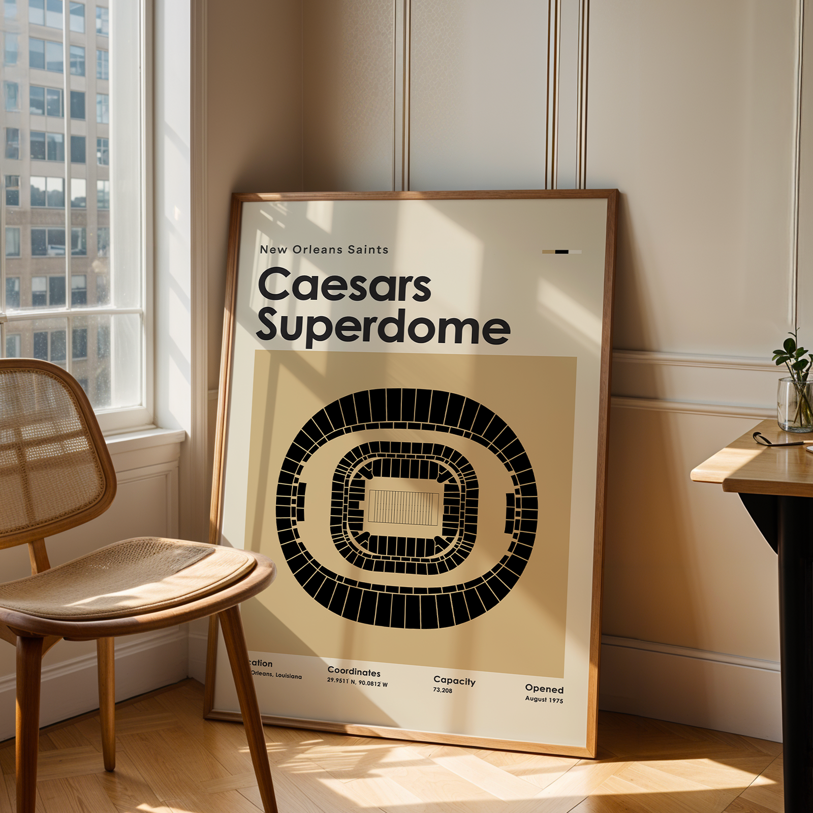 Poster of Caesars Superdome in a room with a chair and table.