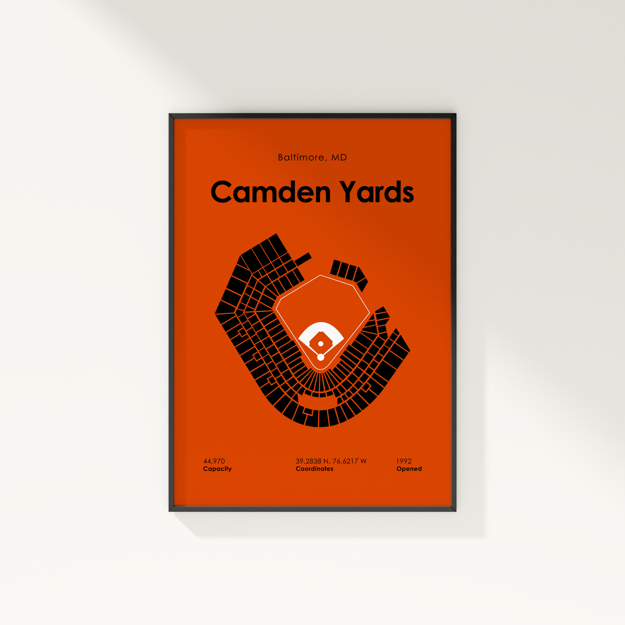 Framed poster of Camden Yards stadium layout on an orange background