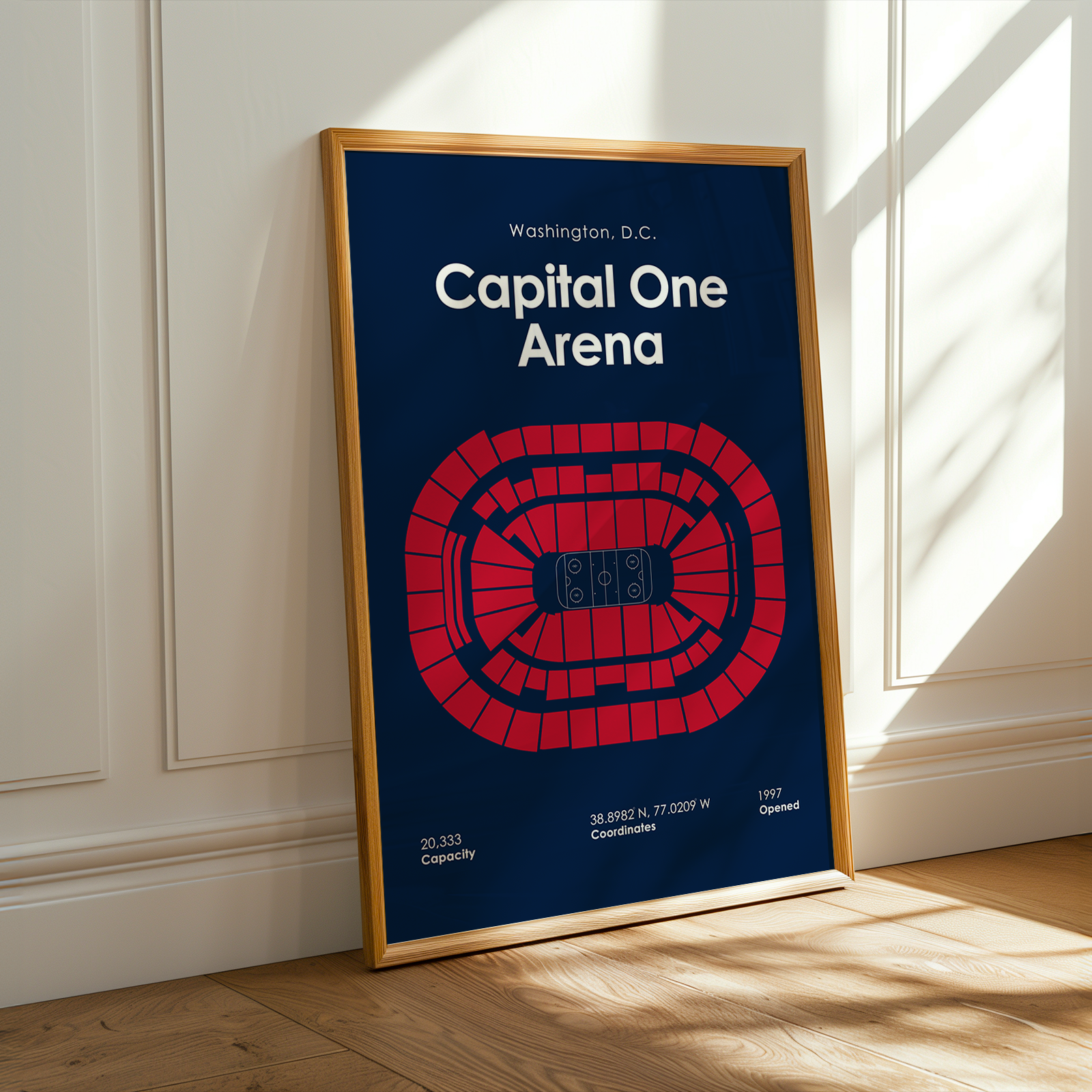 Framed poster of Capital One Arena layout on a wall.