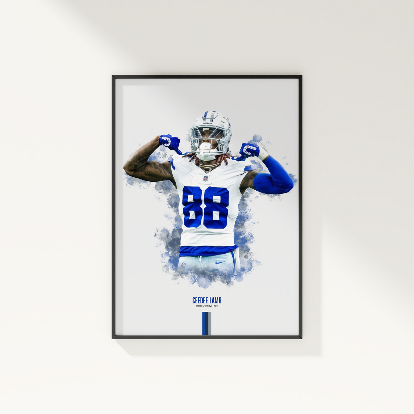 framed poster mockup of football player ceedee lamb hanging on a white wall