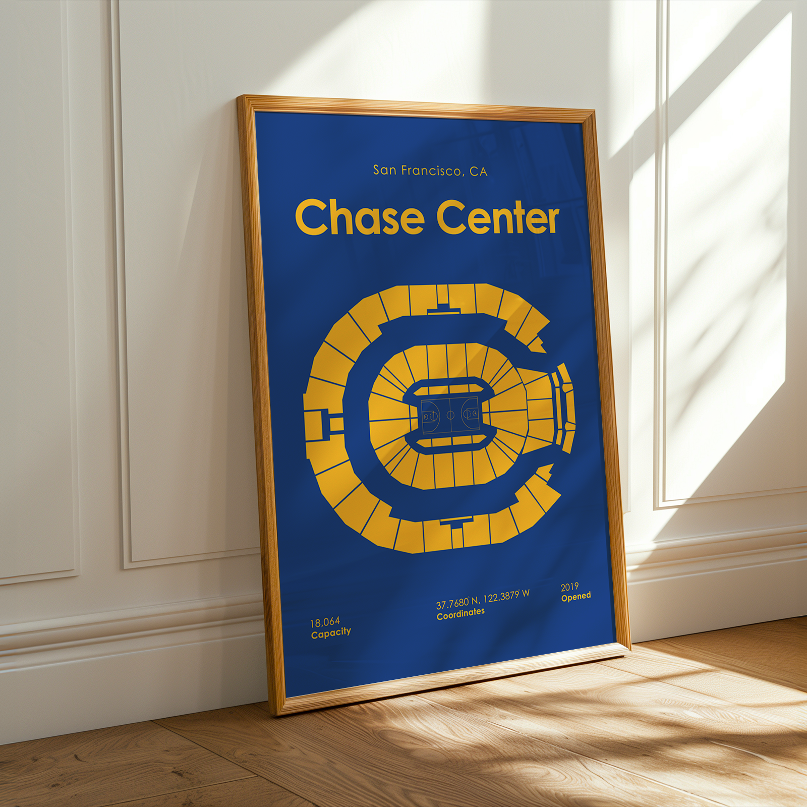 Framed poster of the Chase Center in San Francisco on a wall.