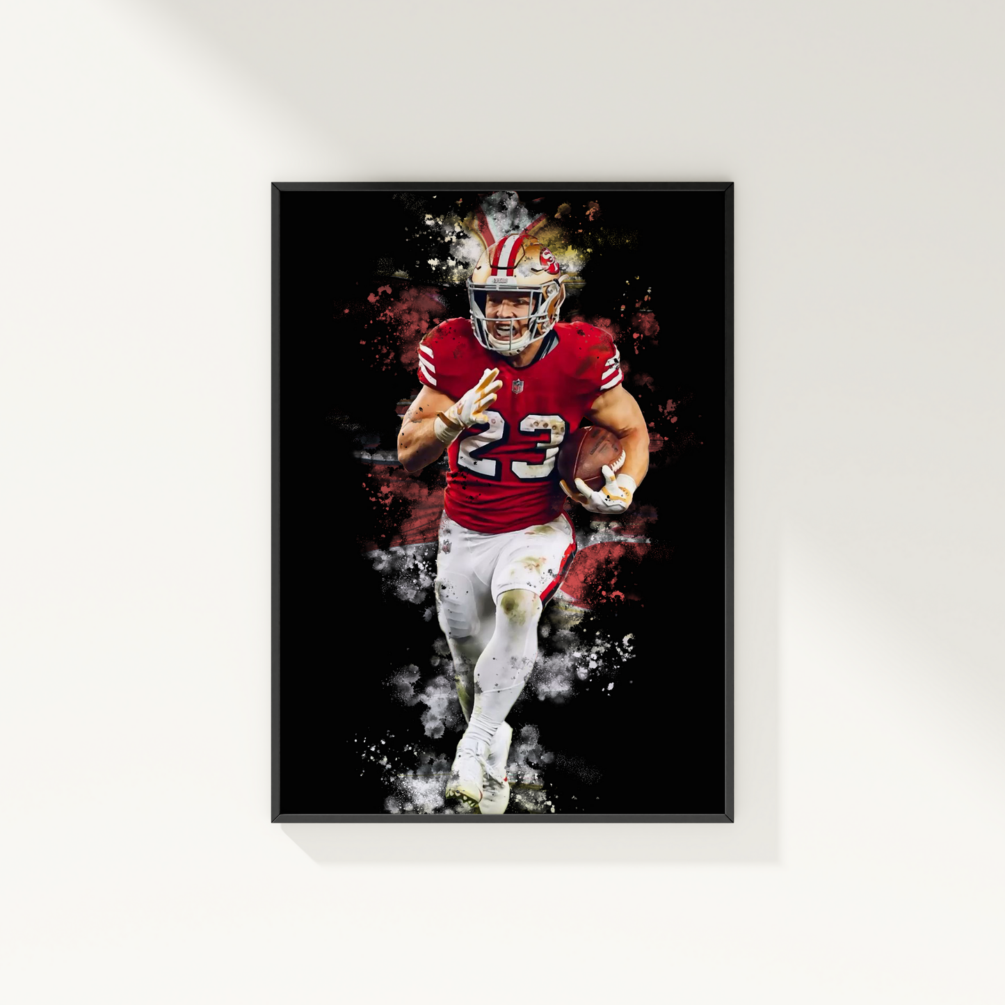 framed poster mockup of football player christian mccaffrey hanging on a white wall