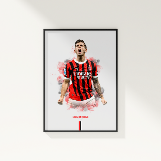 Framed poster print of soccer player Christian Pulisic, wearing an AC Milan jersey, on a white wall.