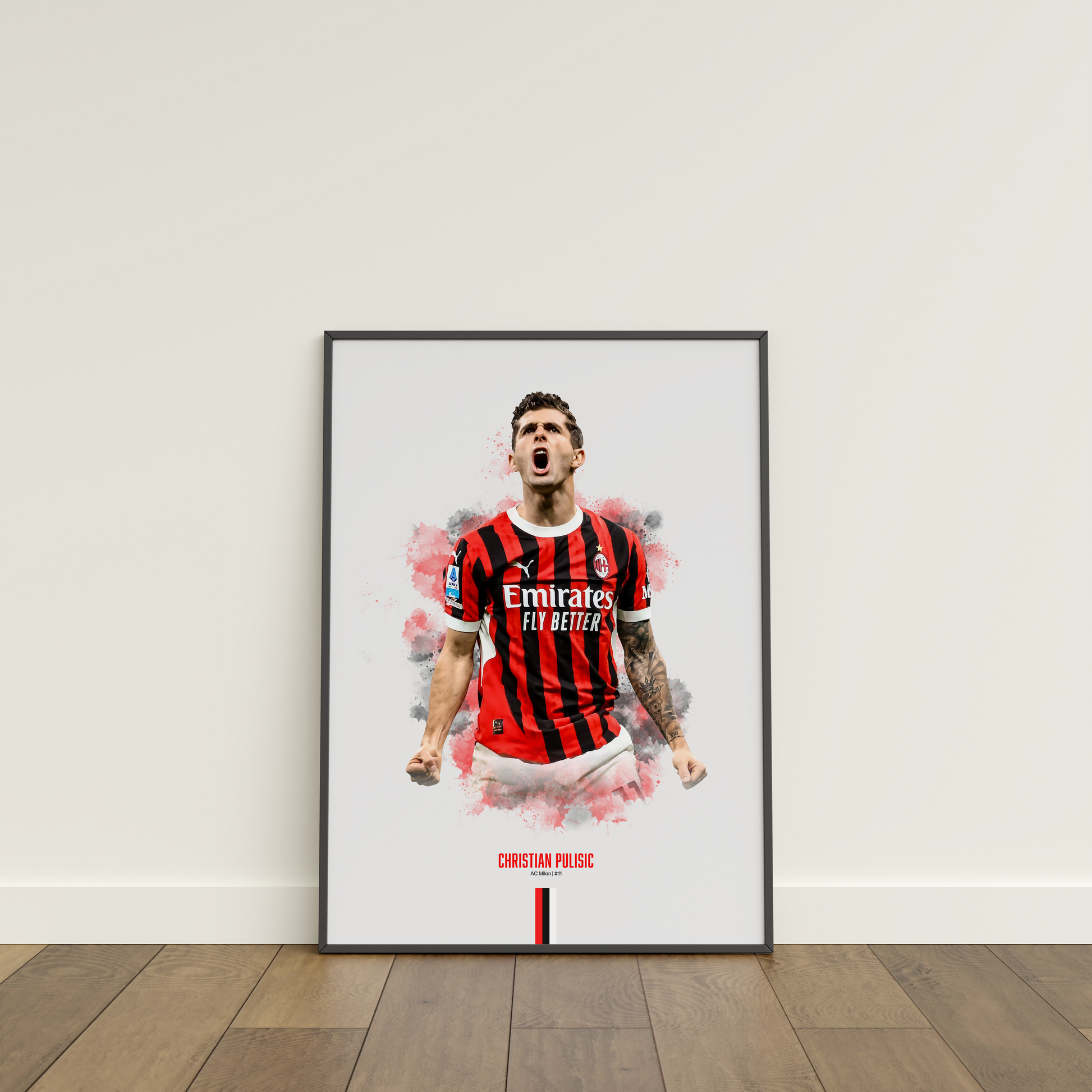 Framed poster print of soccer player Christian Pulisic, wearing an AC Milan jersey, on a white wall.