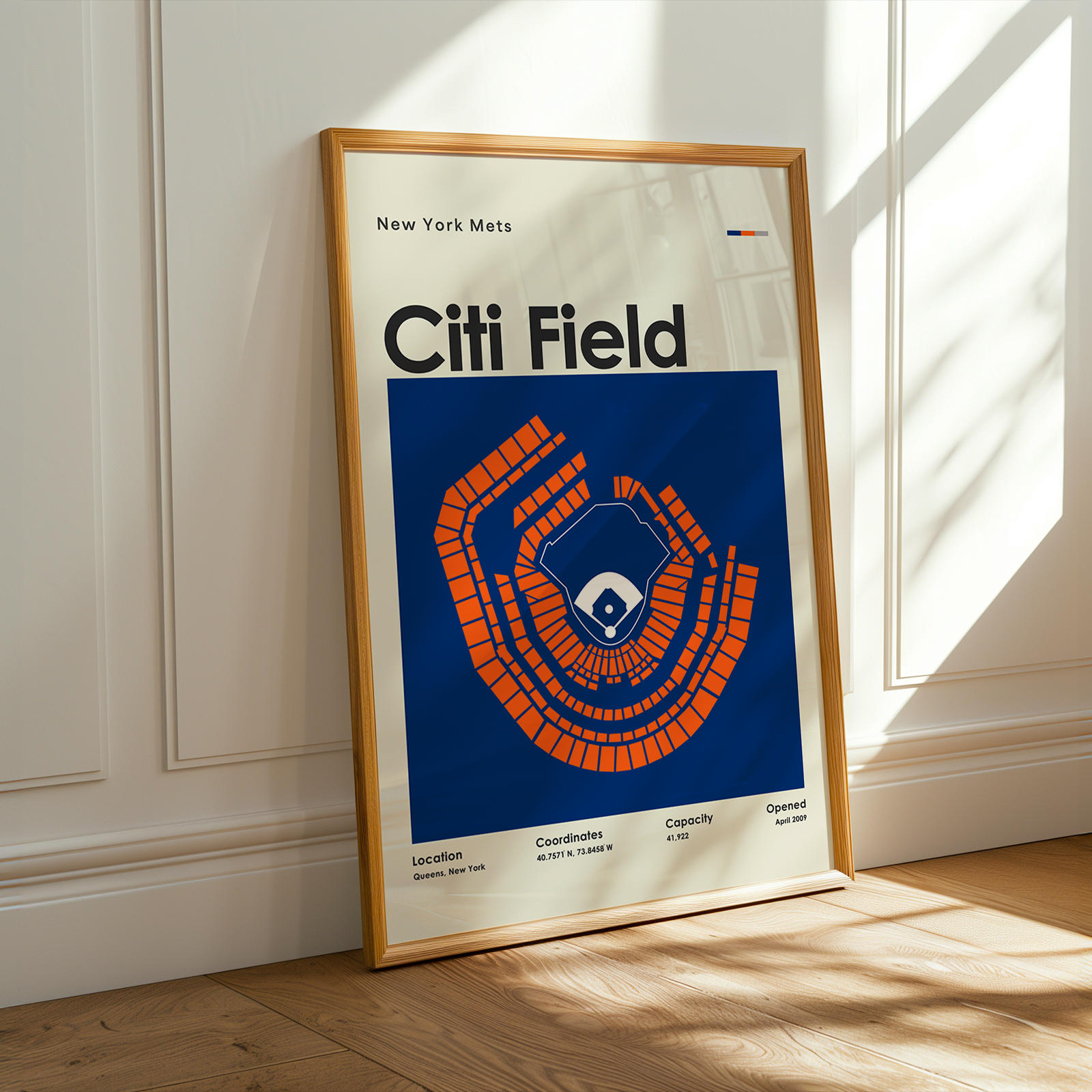 Framed poster of Citi Field with New York Mets logo on a wooden floor.