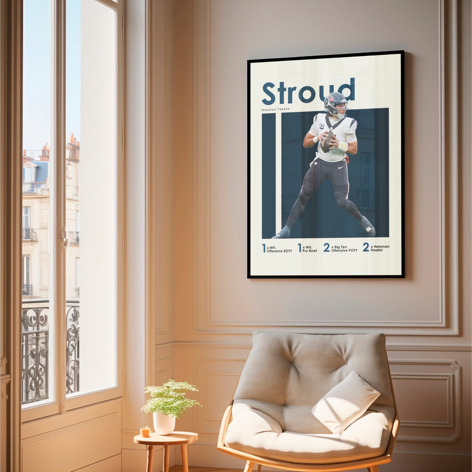 framed poster mockup of football player cj stroud hanging in a living room