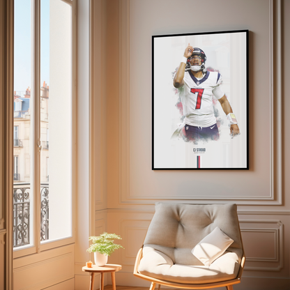 framed poster mockup of football player cj stroud hanging in a living room