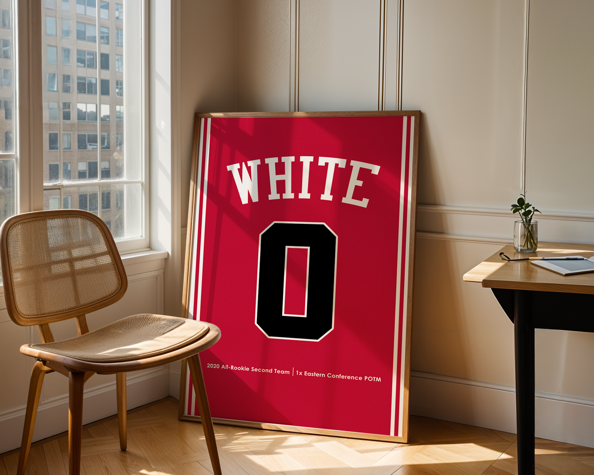 Red sports jersey with 'WHITE' and number '0' displayed in a room with a chair and table.