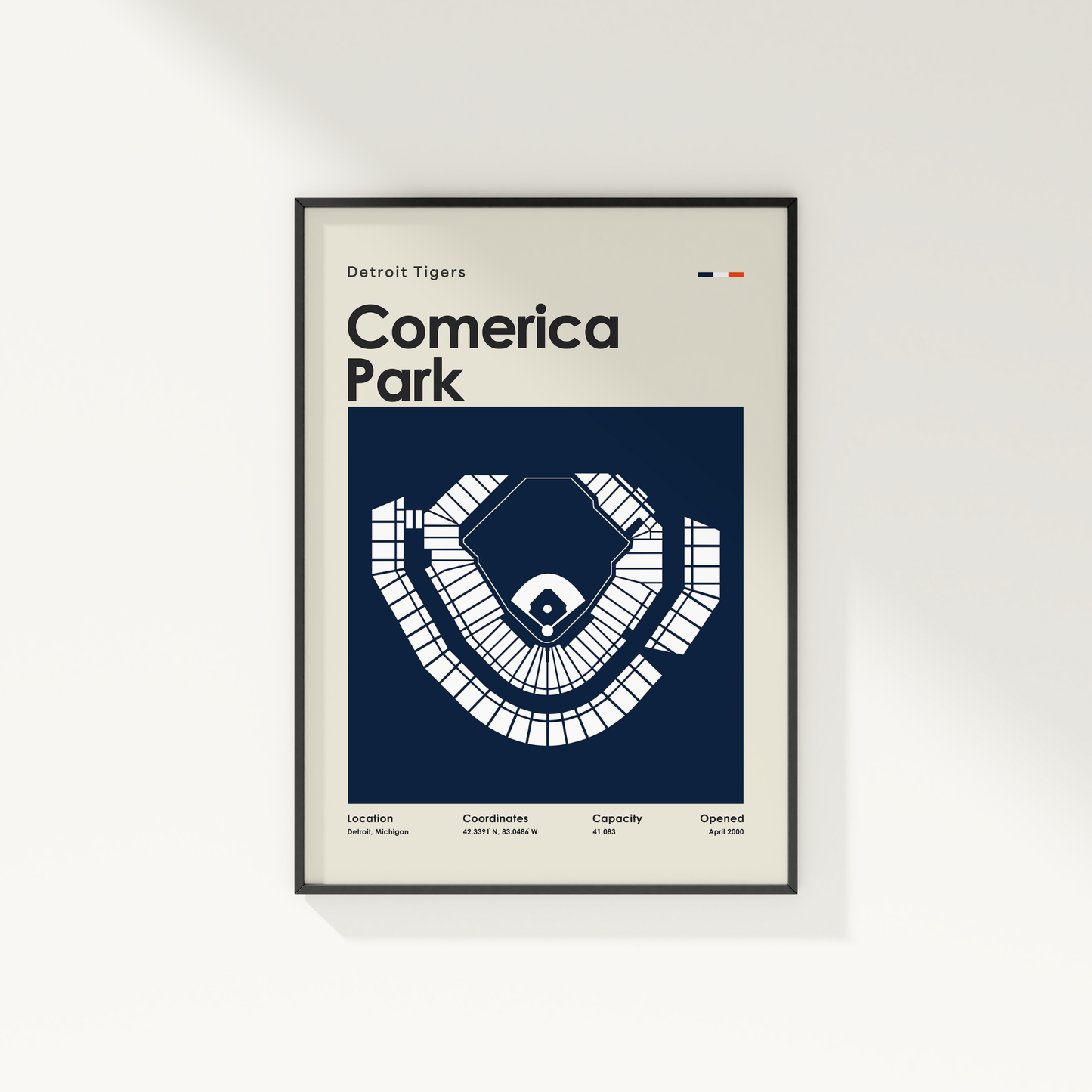 Framed poster of Comerica Park with Detroit Tigers text on a white wall.