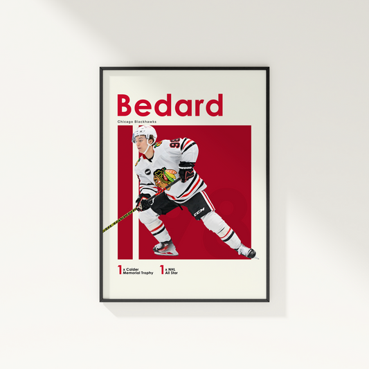 framed poster mockup of hockey player connor bedard hanging on a white wall