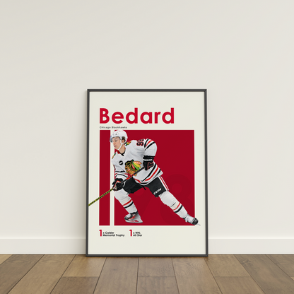 framed poster mockup of hockey player connor bedard leaning on a white wall