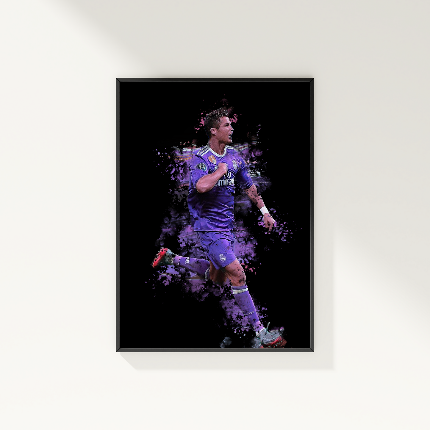 framed poster mockup of soccer player cristiano ronaldo hanging on a white wall