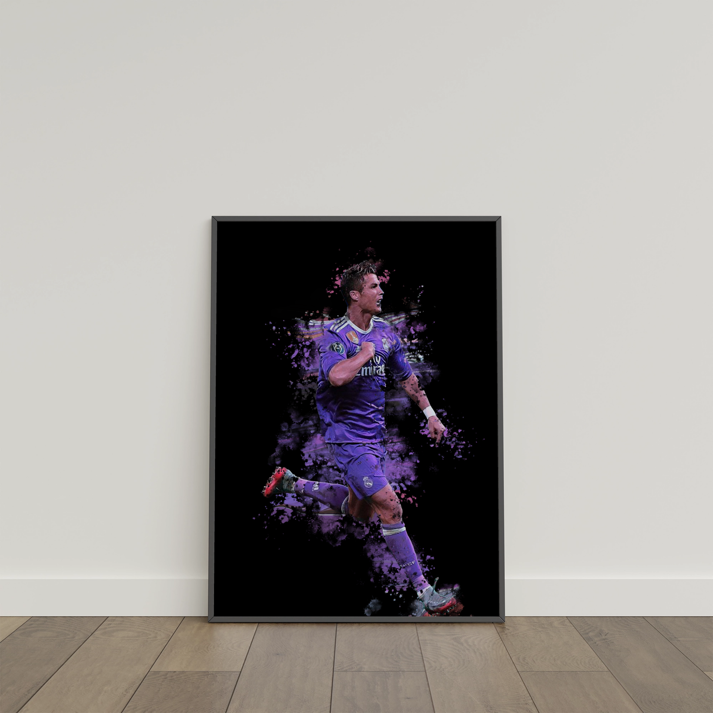 framed poster mockup of soccer player cristiano ronaldo leaning on a white wall