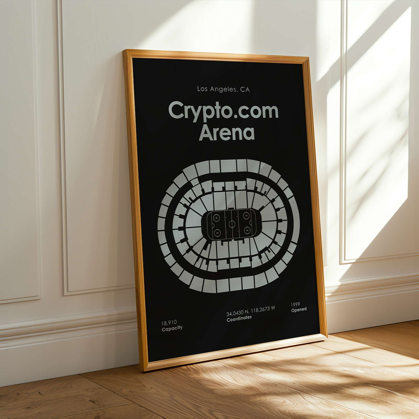 Framed poster of Crypto.com Arena in Los Angeles, CA on a wall.