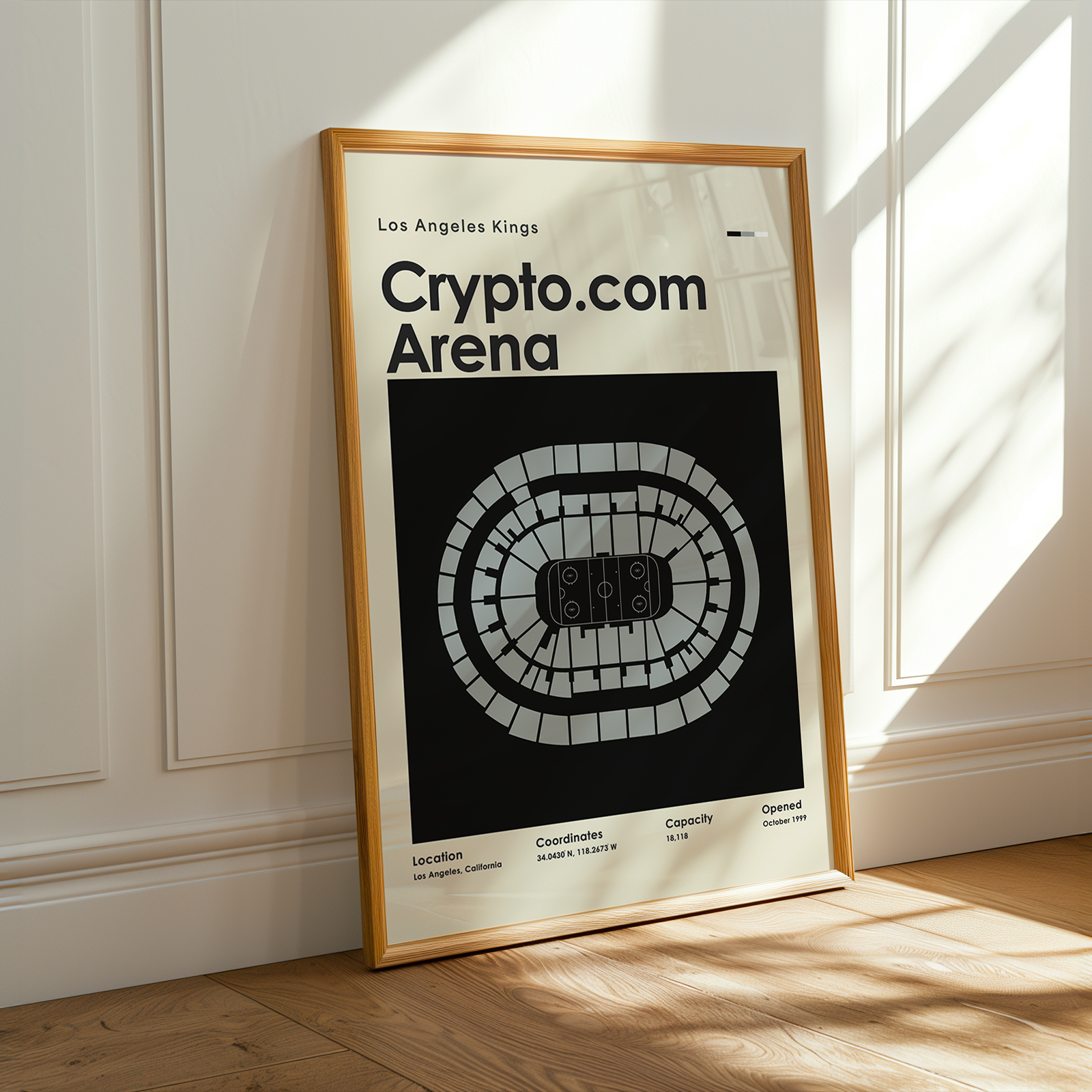 Framed poster of Crypto.com Arena in a room with sunlight streaming through a window.