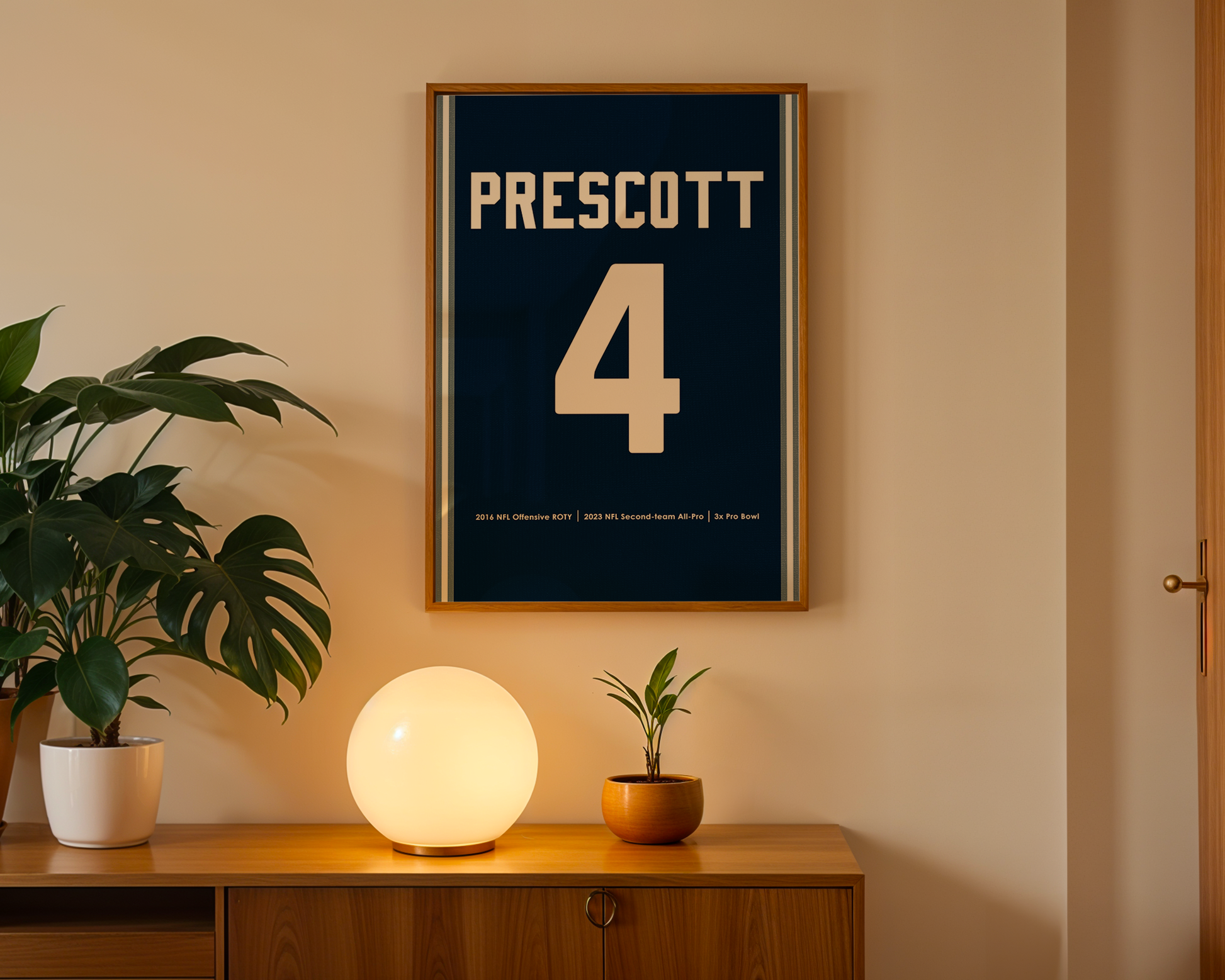 Framed poster with 'Prescott 4' on a wall above a wooden cabinet with decorative items.