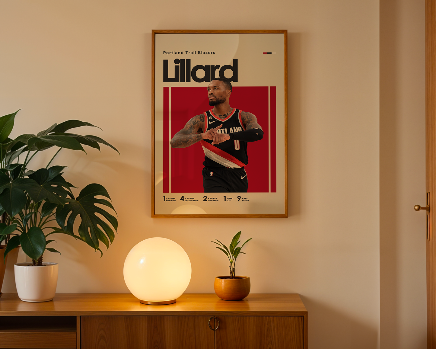 Framed poster of a basketball player on a wall above a wooden cabinet with decorative items.