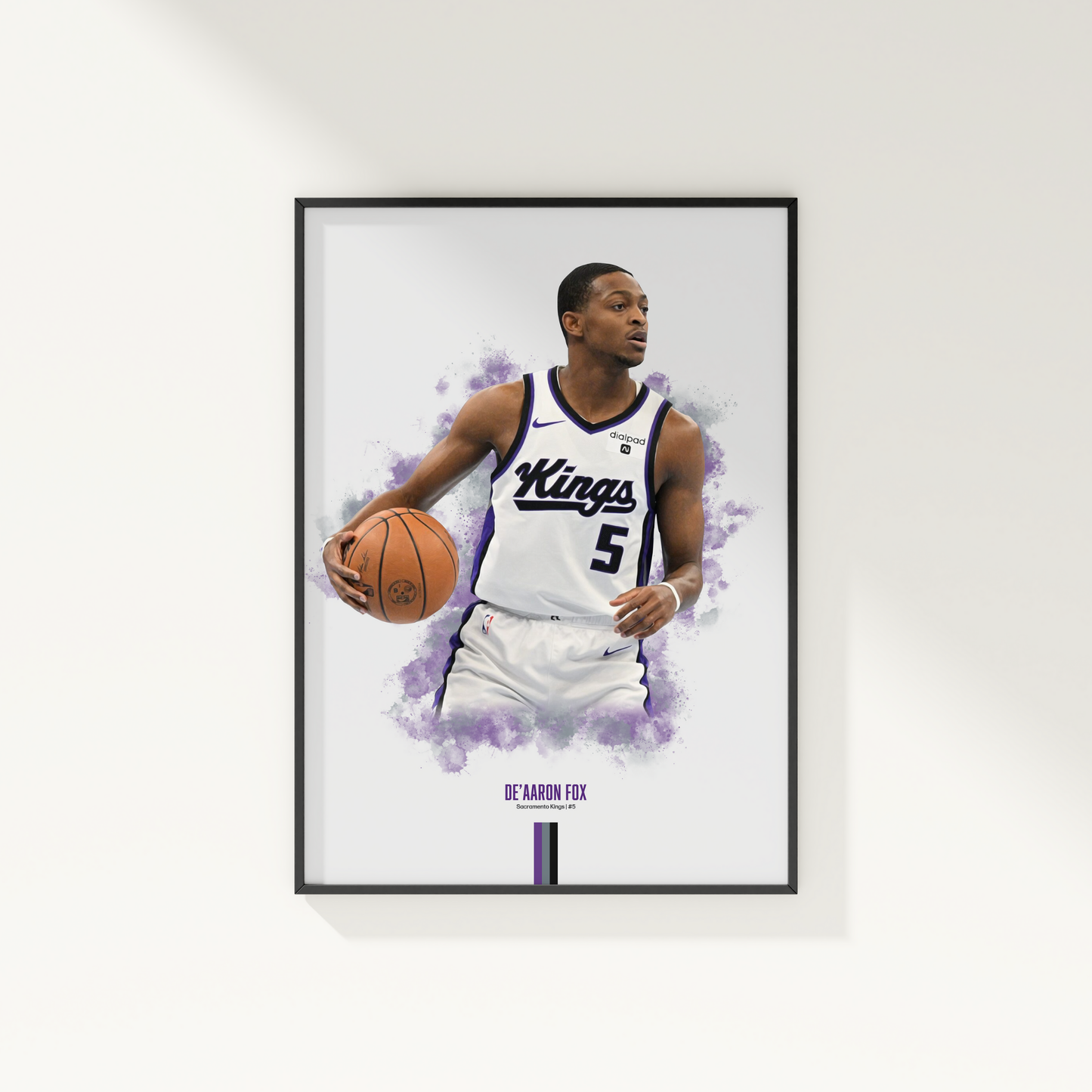 framed poster mockup of basketball player de'aaron fox hanging on a white wall