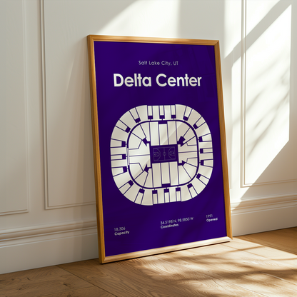 Framed poster of Delta Center layout on a wall with sunlight casting shadows.