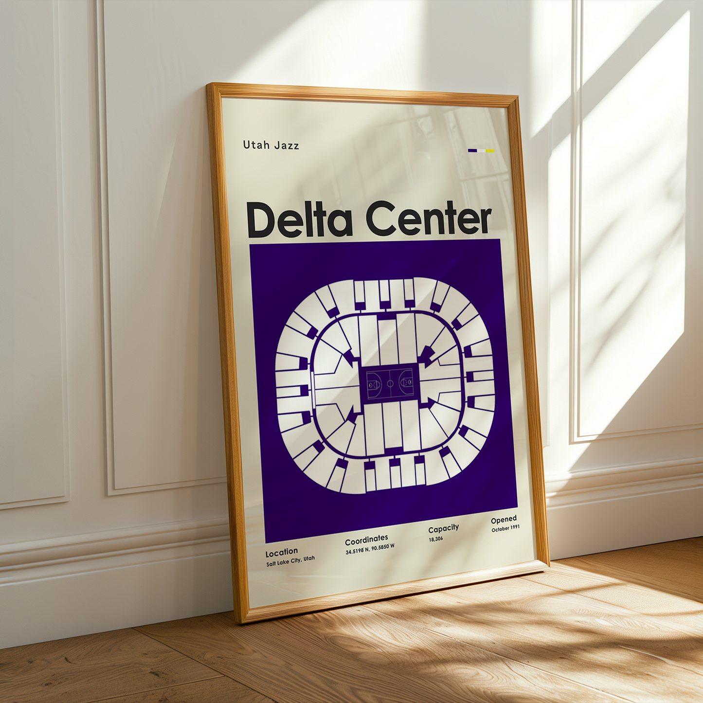 Framed poster of Delta Center in Utah Jazz branding on a wall.