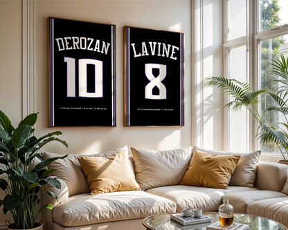 Two framed sports jerseys with names and numbers on a wall above a couch.
