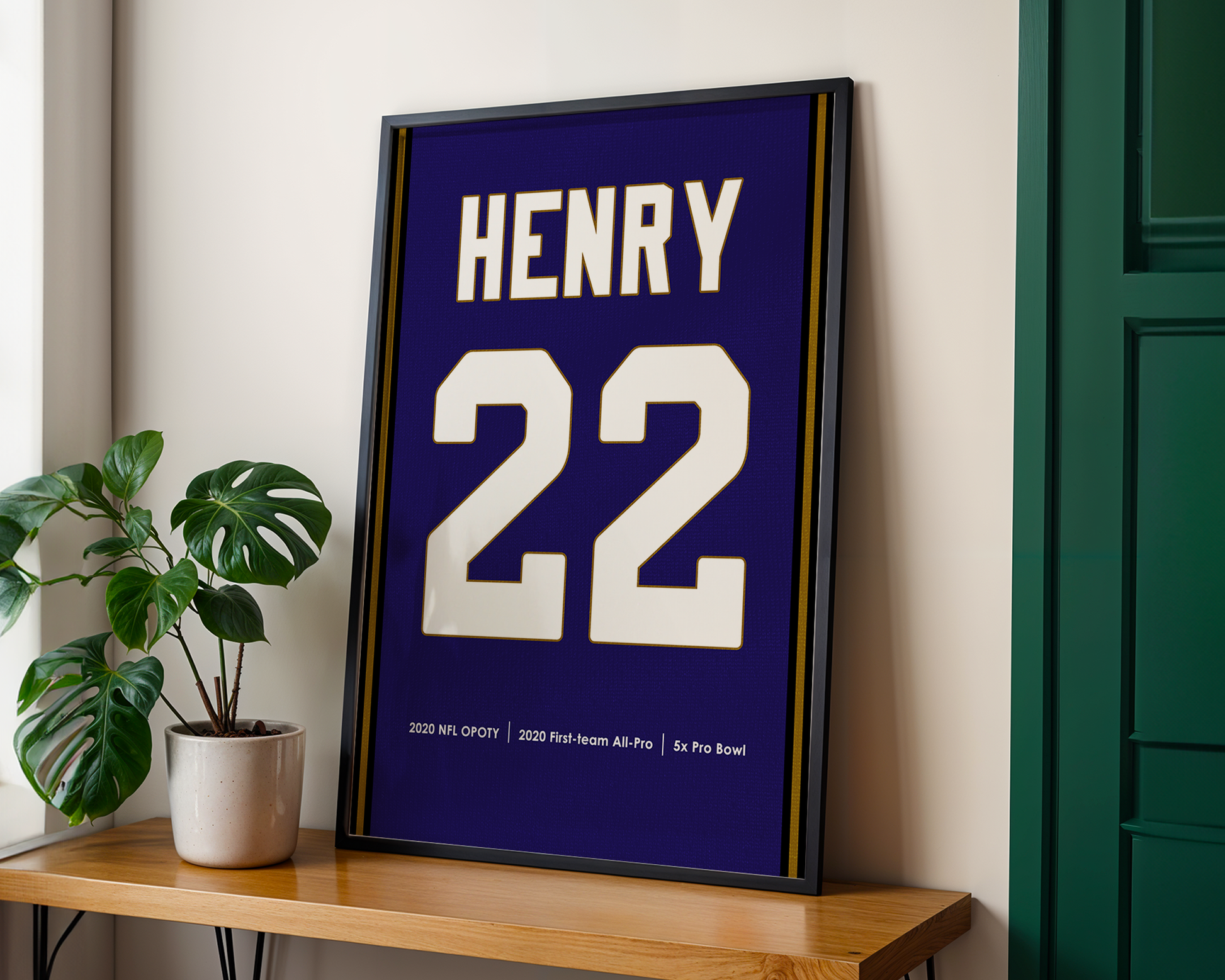 Framed sports jersey with 'HENRY' and number '22' on a wooden shelf.
