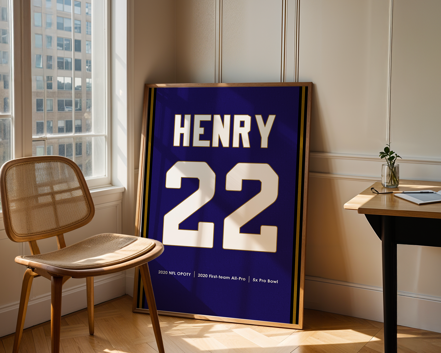 Framed sports jersey with name and number 'HENRY 22' in a room with a window and chair.