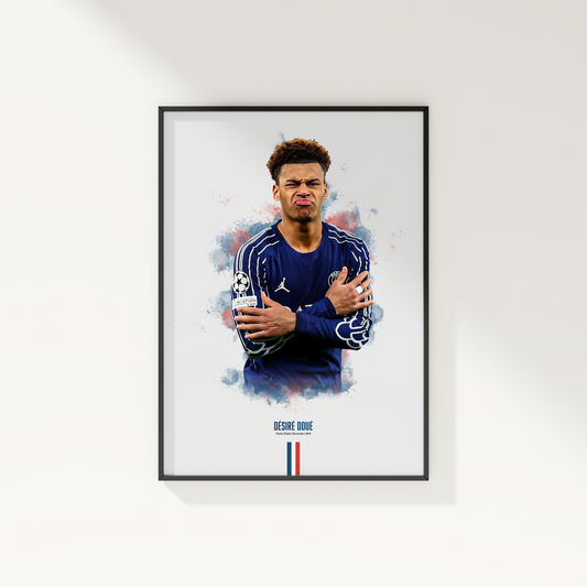 Framed poster print of soccer player Desire Doue, wearing a PSG jersey, on a white wall.