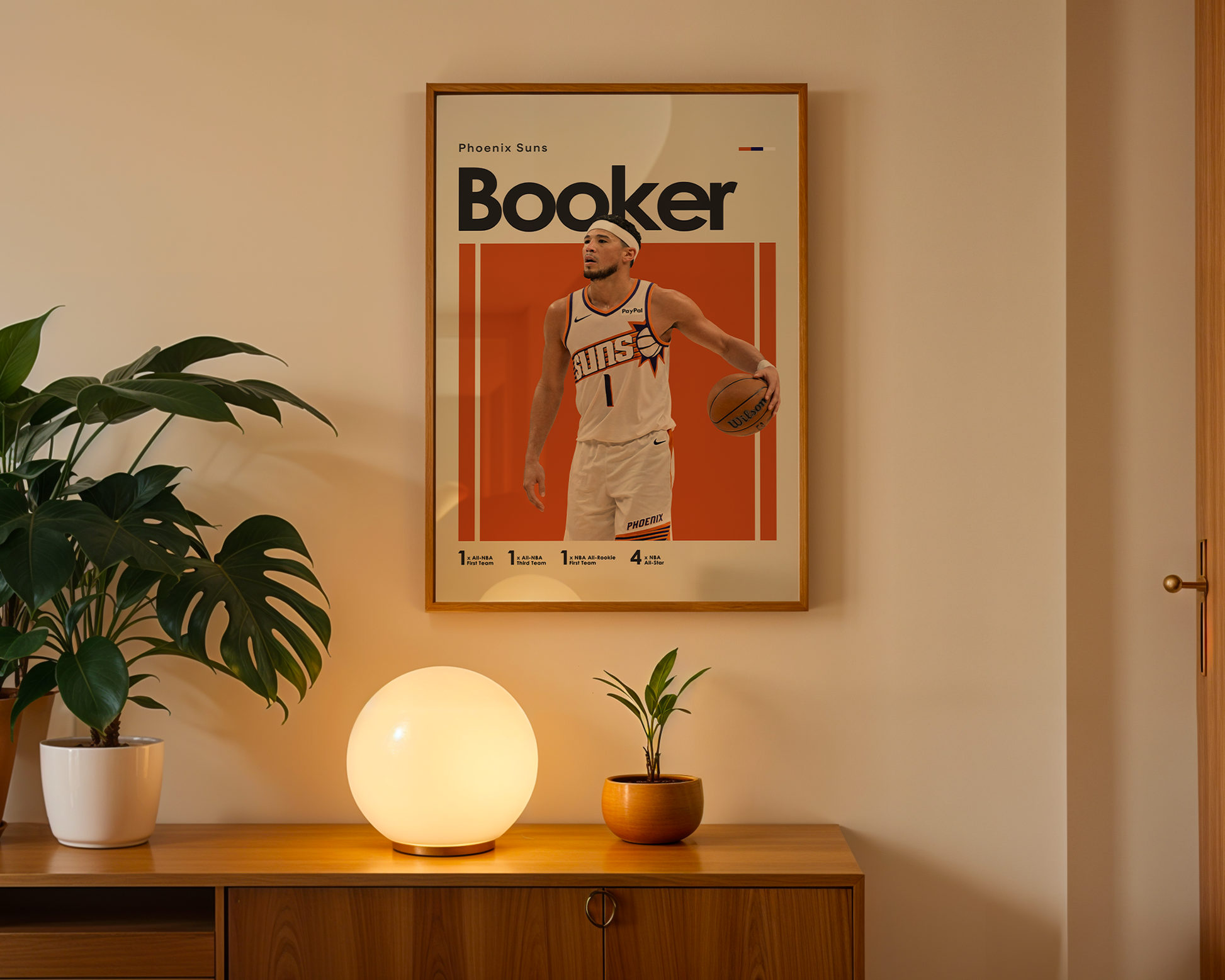 Poster of a basketball player named 'Booker' on a wall above a wooden cabinet with decorative items.