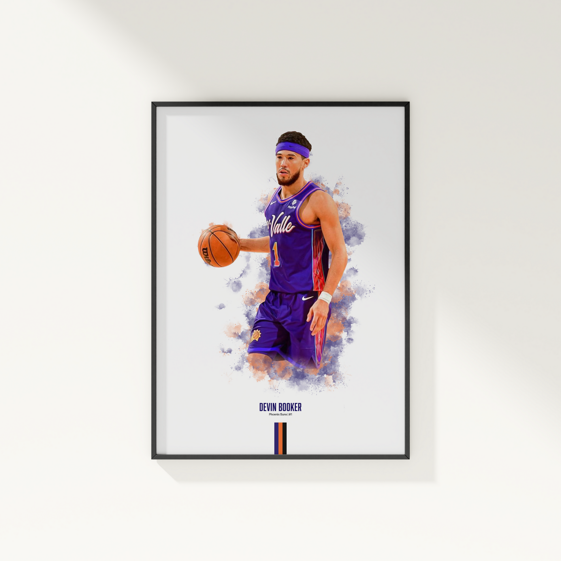 framed poster mockup of basketball player devin booker hanging on a white wall