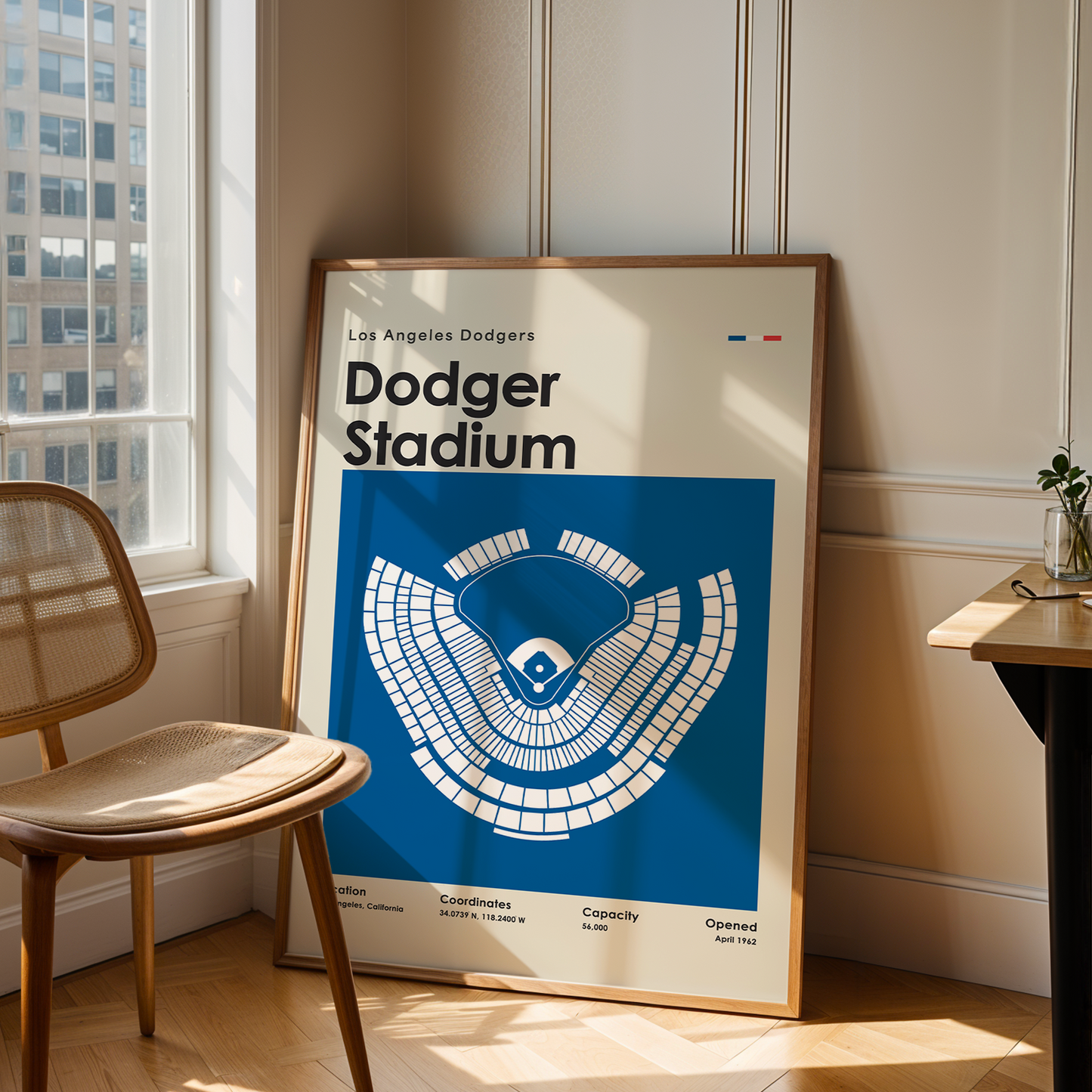 Framed poster of Los Angeles Dodgers Dodger Stadium in a room with a chair and table.