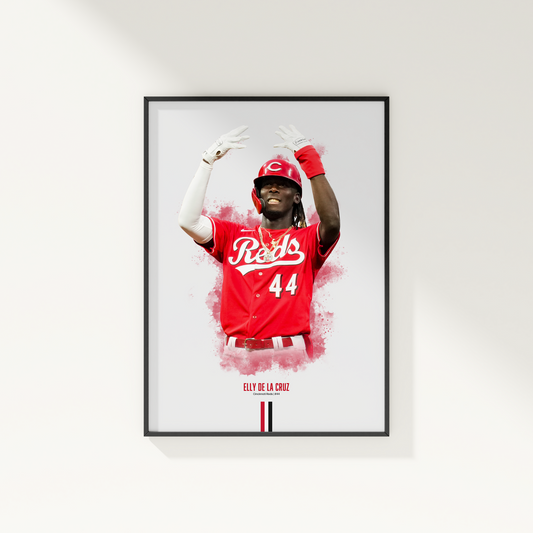 framed poster mockup hanging on a white wall. poster of baseball player elly de la cruz celebrating for the cincinnati reds.