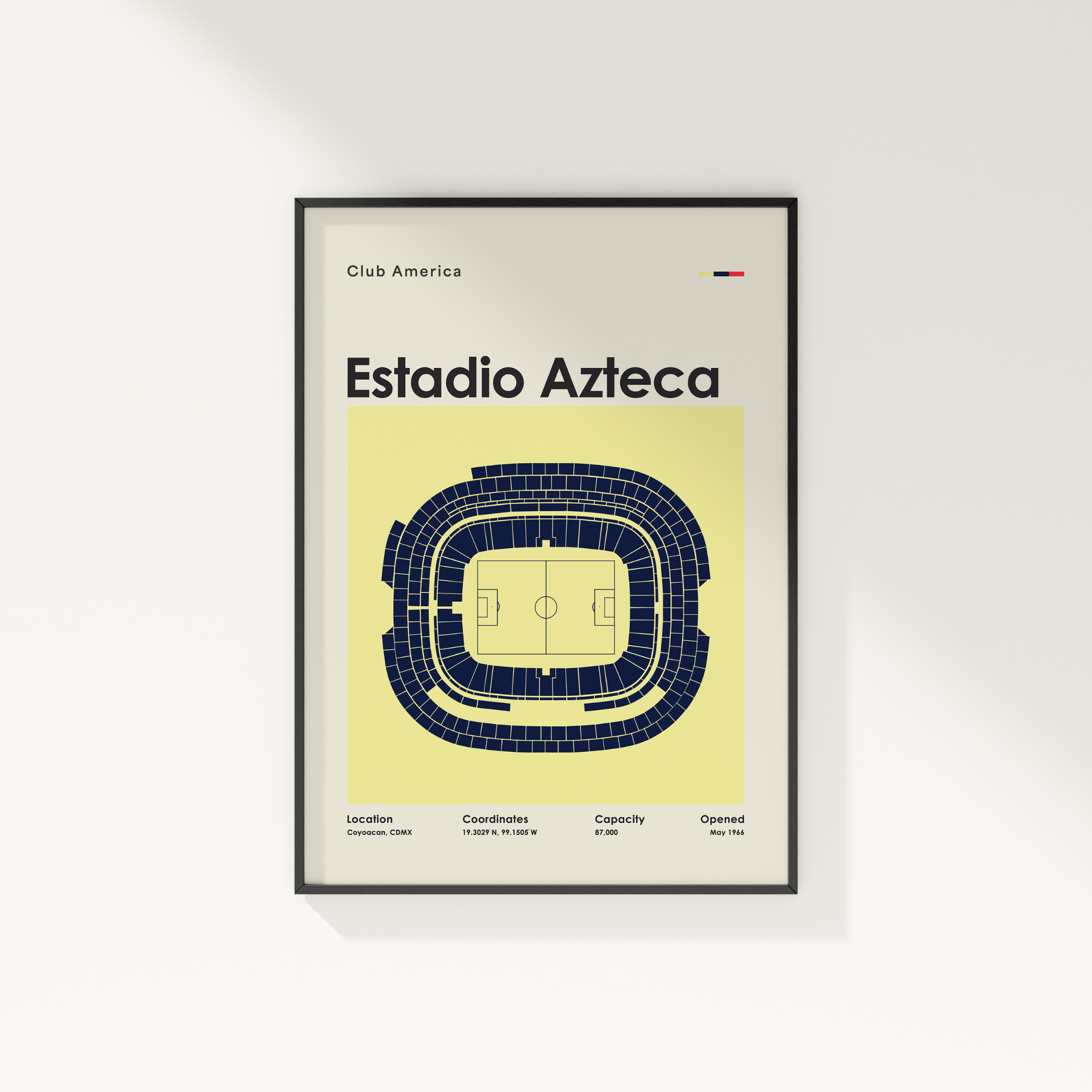 A framed minimalist poster of Estadio Azteca from Club America, featuring a top-down stadium diagram on a pale yellow background, hanging on a white wall.