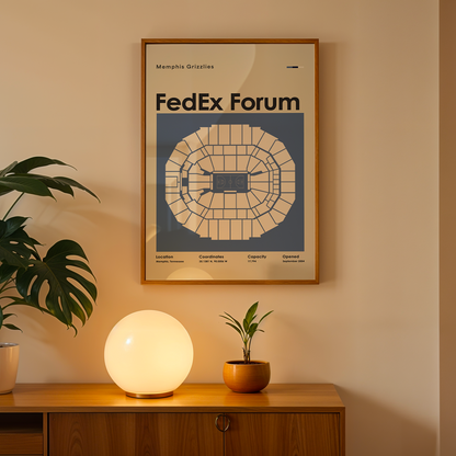 Framed poster of FedEx Forum on a wall above a wooden cabinet with decorative items.