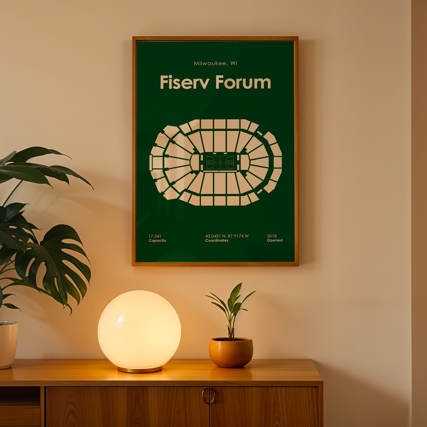 Fiserv Forum poster on a wall above a wooden cabinet with decorative items.