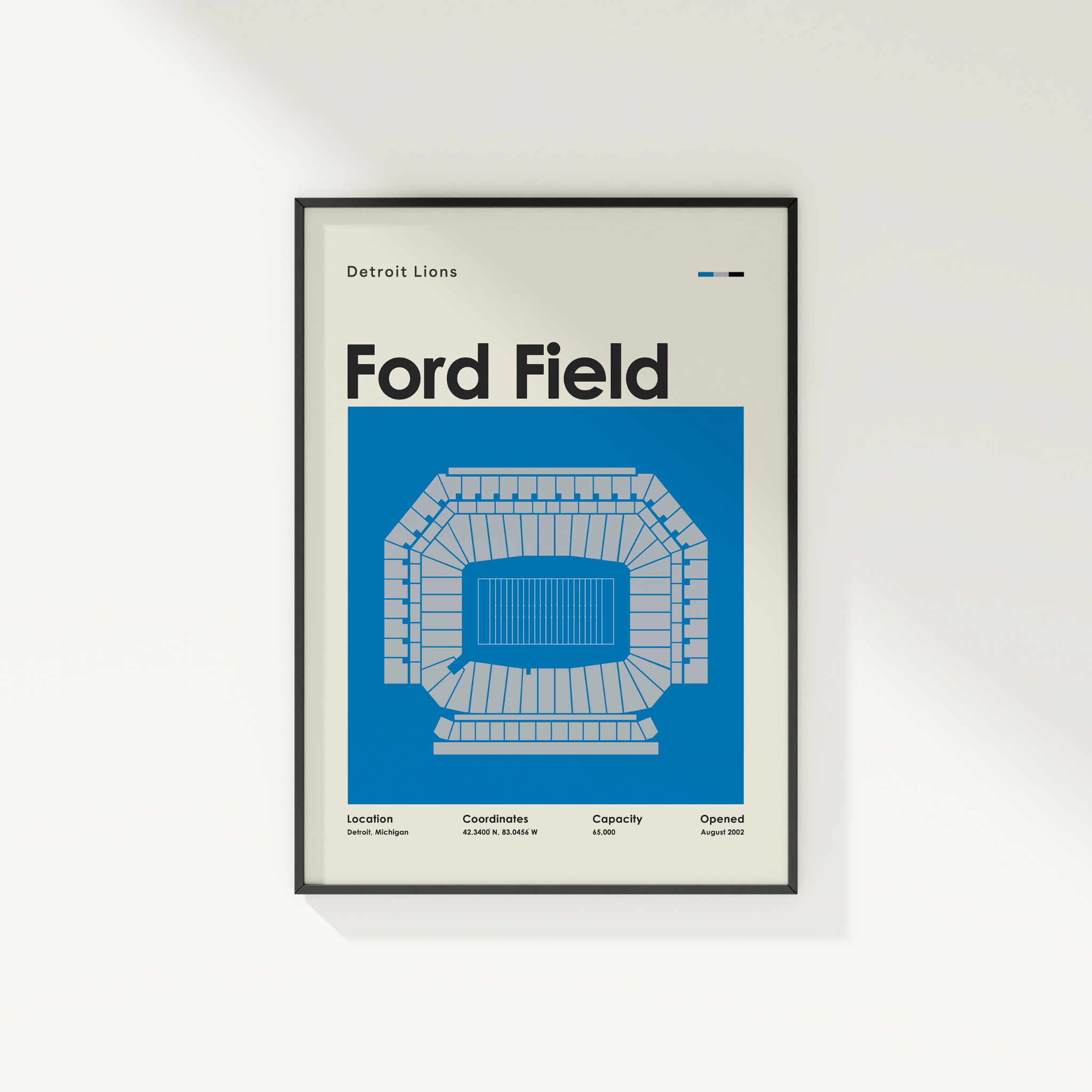 Framed poster of Ford Field with Detroit Lions text on a white wall