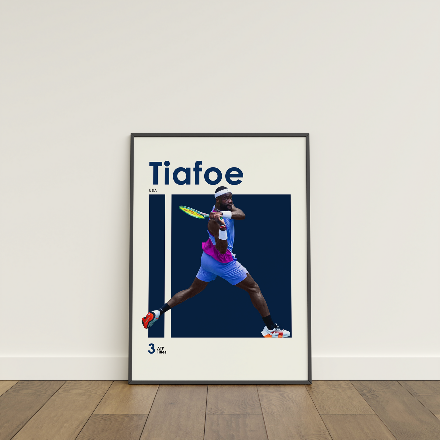 framed poster mockup of tennis player frances tiafoe leaning on a white wall