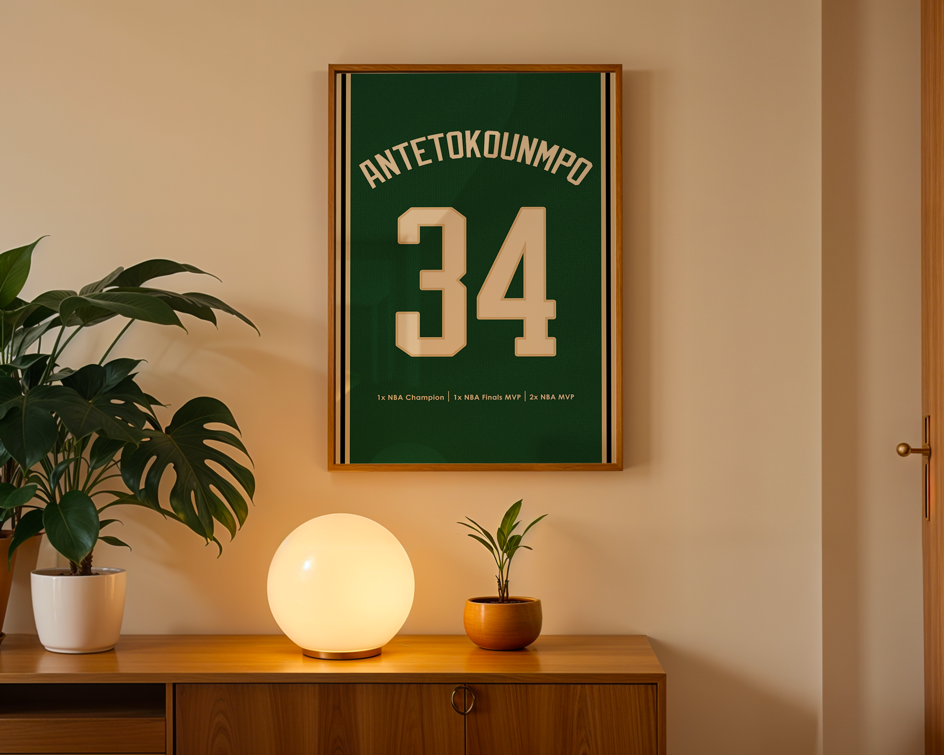 Framed sports jersey with number 34 on a wall above a wooden cabinet with decorative items.