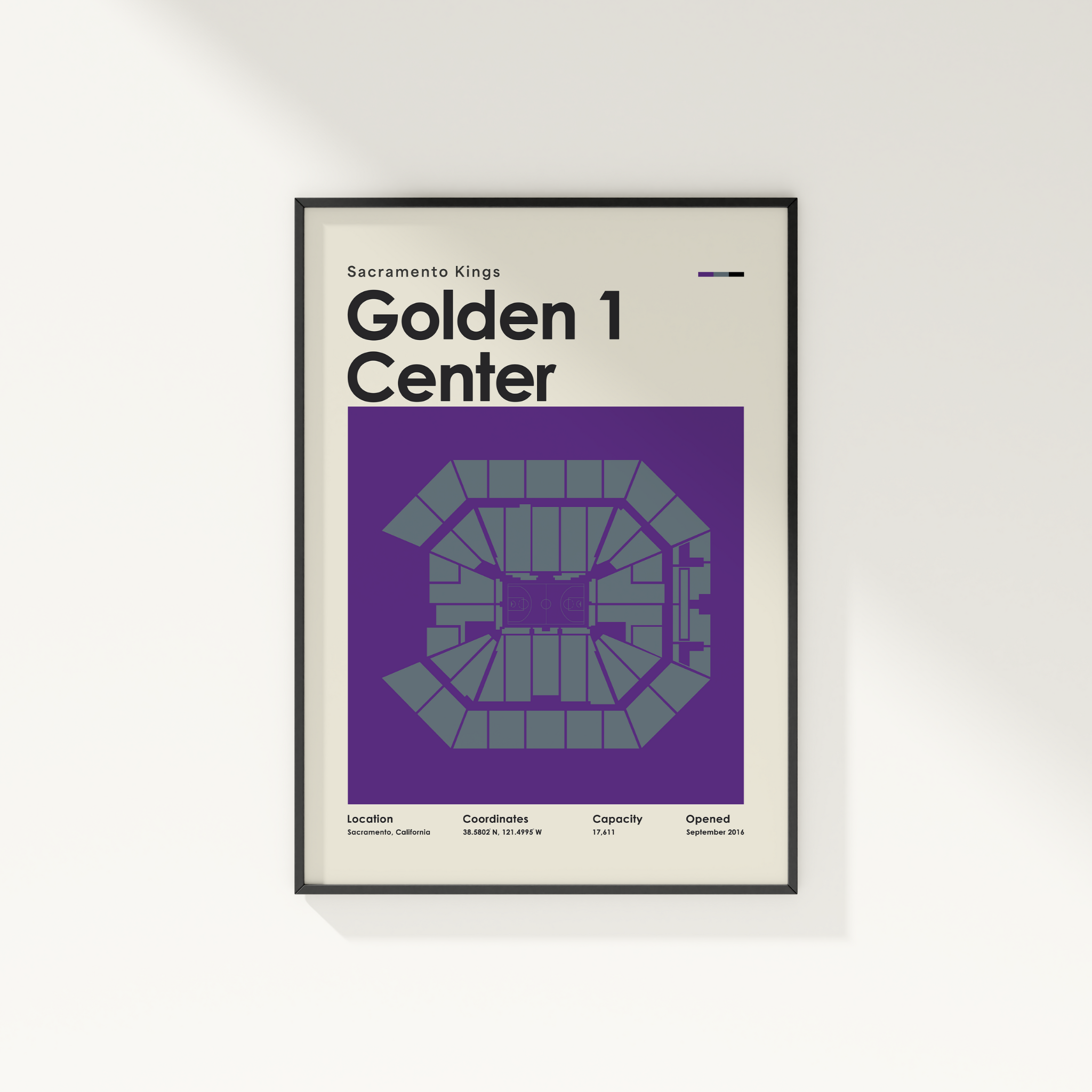 Framed poster of Golden 1 Center with Sacramento Kings text on a white wall.